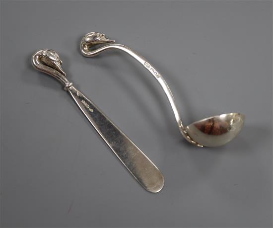 A modern silver ladle and latter opener by Sara Jones, London, 1994 & 1996, both with swan head terminals, largest 12cm.